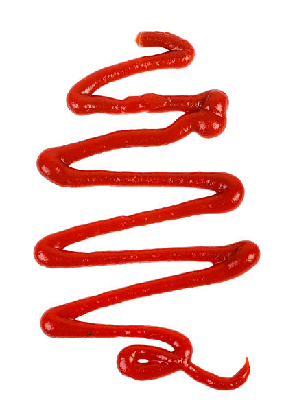 Ketchup line Close up of ketchup line on white background squirting stock pictures, royalty-free photos & images