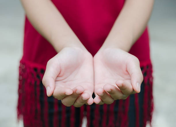 istock female hands as if holding something. Focus on finger 490308596
