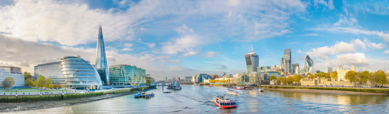 London skyline, United Kingdom - cityscape with modern buildings and Tower of London in autumn under blue bright sky