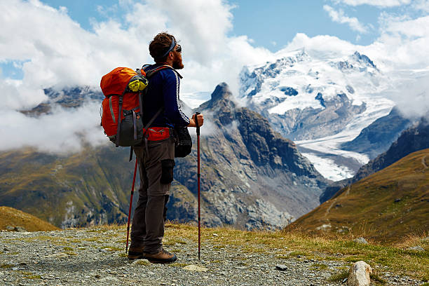 istock hiker at the top of a pass 490309502