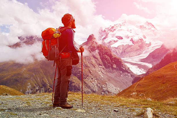 istock hiker at the top of a pass 490309620