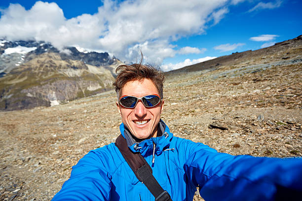 istock hiker at the top of a pass 490309806