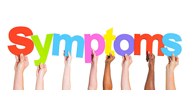 istock Diverse Hands Holding The Word Symptoms 490310289