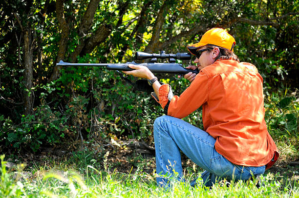 istock Man Hunting in Blaze Orange 490310692