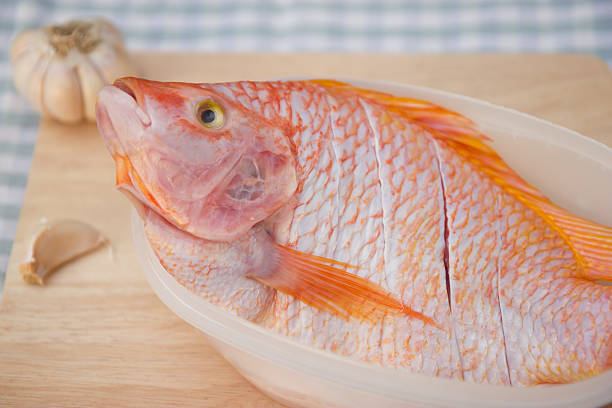 istock Fresh fishes on chopping block 490311716