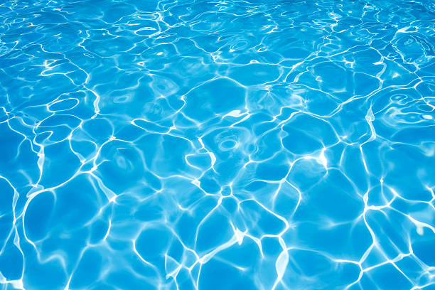 istock Blue and bright water surface in swimming pool 490311748