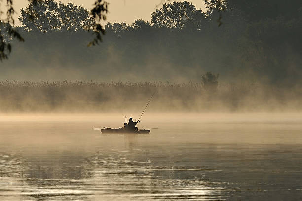 istock fisherman in the fog 490312155