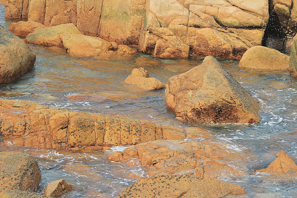 istock rocky sea coast and blurred water in shek o 490313258