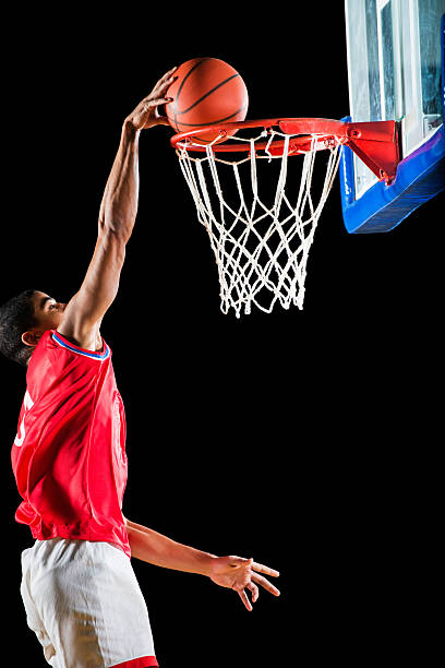 istock Basketball player slam dunking the ball. 490313543