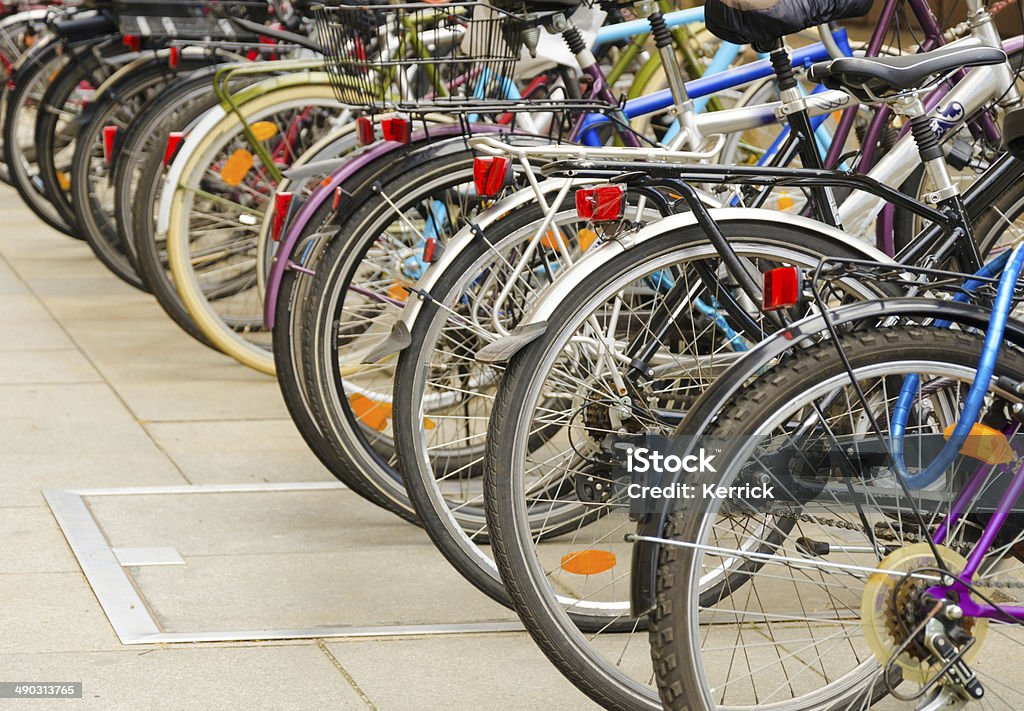 lot of bicycles parking a lot of bicycles parking in the city and waiting for their owners. Bicycle Stock Photo