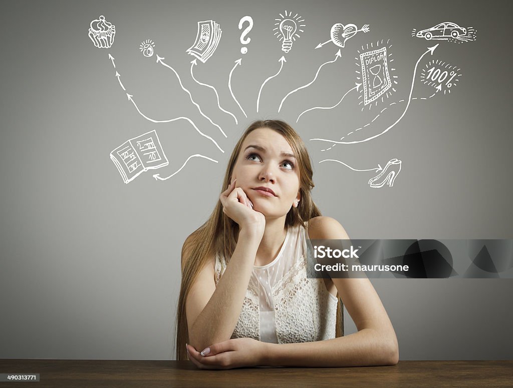 Dreaming Girl in white is dreaming about something. Currency Stock Photo