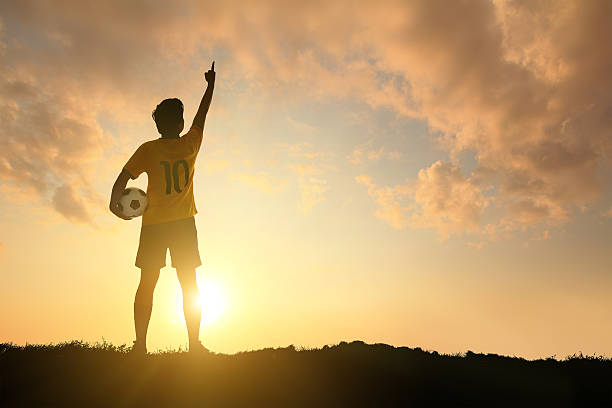 istock Man and soccer silhouette 490313853