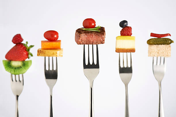 Menu Foods on forks. pepper cake stock pictures, royalty-free photos & images