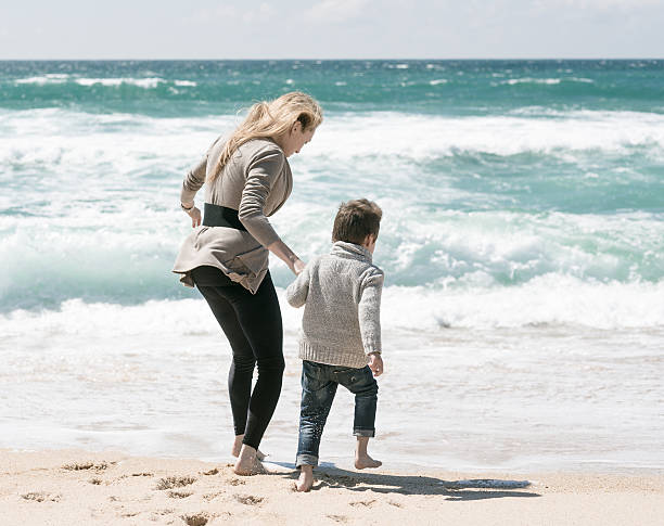 istock Son and Mom Looking to Sea 490314379