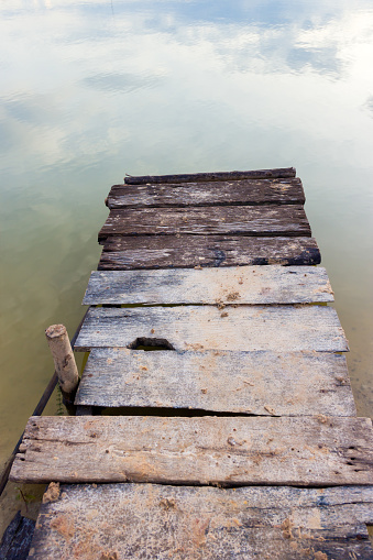 wooden pier at lake.