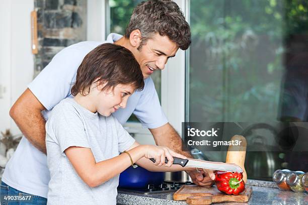 Father And Son Cooking Home Kitchen Slicing Stock Photo - Download Image Now - Cooking, Boys, Family