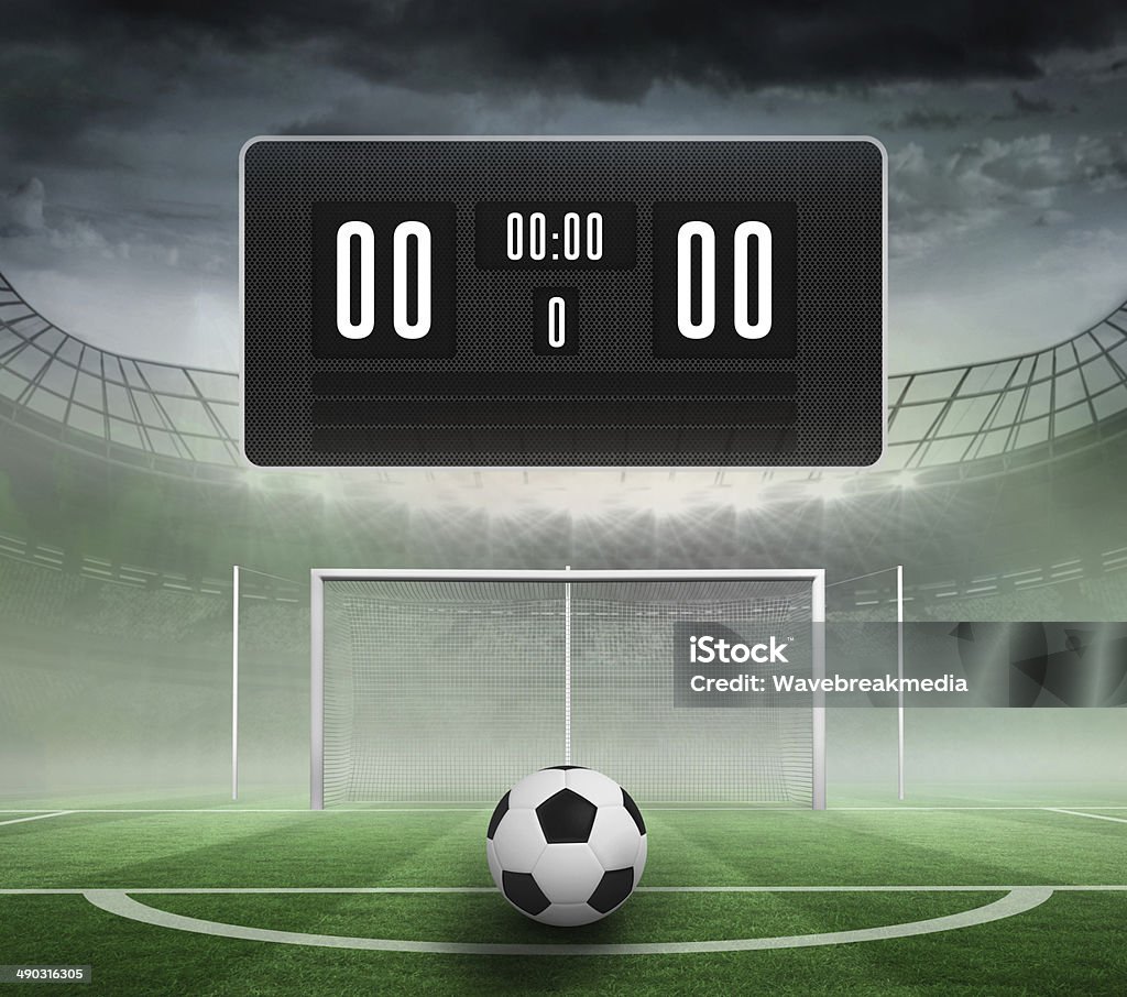 Black scoreboard with no score and football Black scoreboard with no score and football against football pitch in large stadium Scoreboard Stock Photo