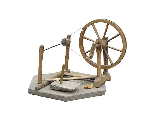 Old manual wooden spinning-wheel distaff isolated on white background