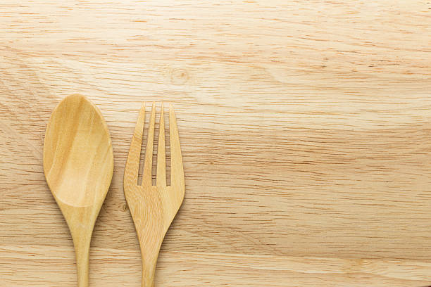 istock Wooden spoon and fork on wood background 490317378