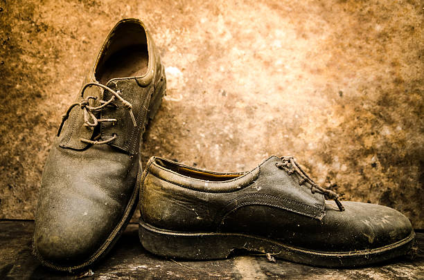 istock still life with boots on wooden table over grunge background 490317496