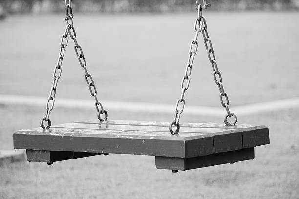 istock swing hanging in garden monochrome 490336870