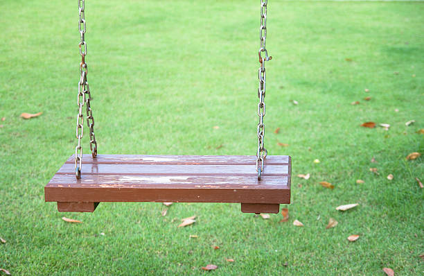 istock swing hanging in garden 490336930