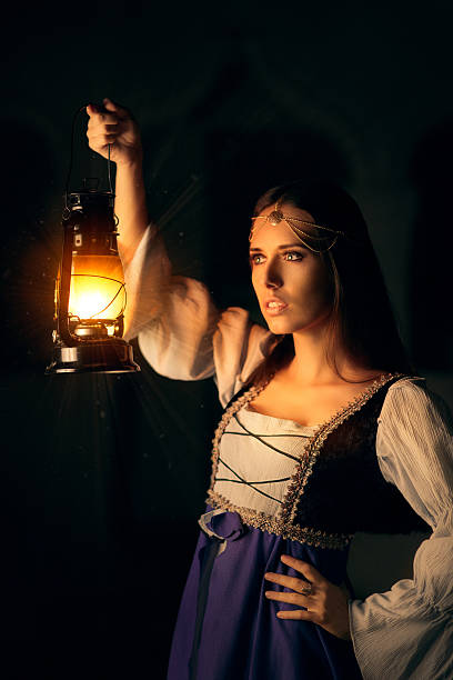 istock Beautiful Medieval Princess Holding Lantern 490337046
