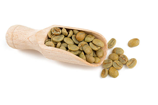 istock green coffee beans in a wooden scoop 490337816