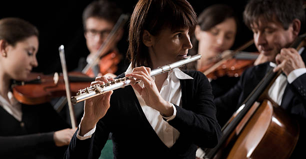 istock Classical music concert: flutist close-up 490338266