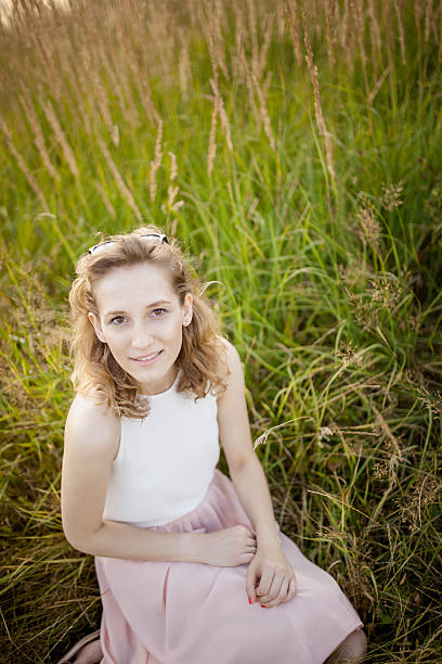 istock Happy woman jumping on meadow. 490341540