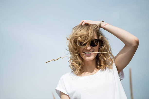 istock Happy woman jumping on meadow. 490341602