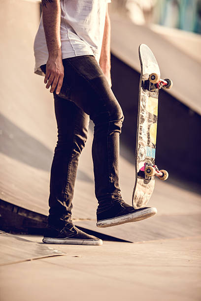 istock Unrecognizable street skateboarder with skateboard. 490342894