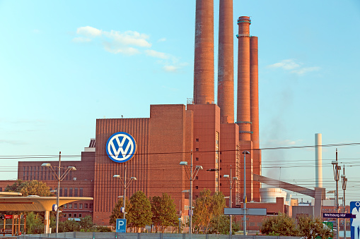 Wolfsburg, Germany - September 26, 2015: Smokestack of the old heating station at industrial area of international automotive manufacturer Volkswagen Group (VW), Wolfsburg, Lower Saxony, Germany