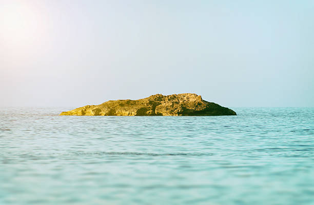 istock Lonely island in deep blue sea. 490345026