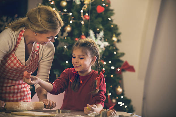 istock Mother and daughter baking cookies for Christmas 490345306