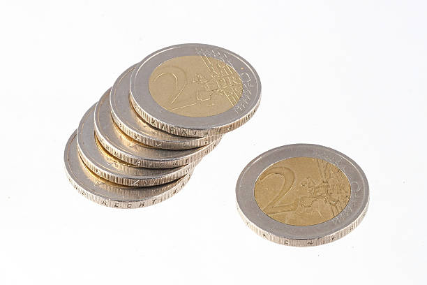 Euro coins on a plain white background. stock photo