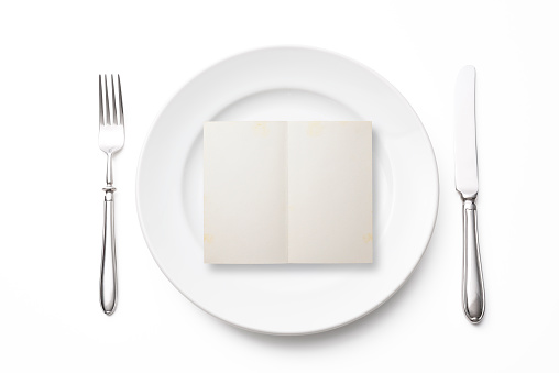Place setting with blank old card, isolated on white background with clipping path.