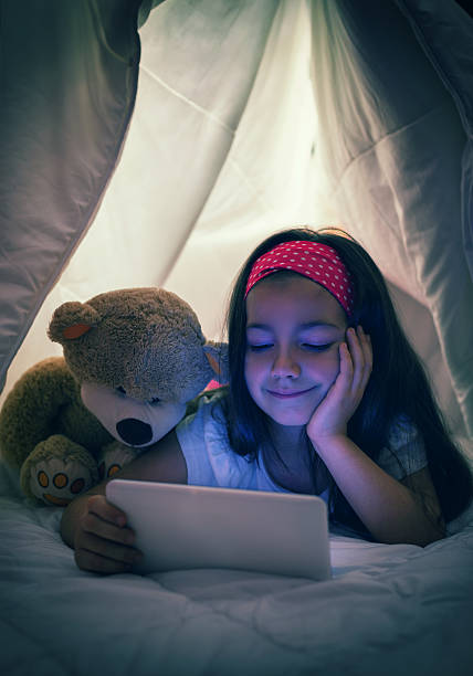 istock Little Girl Using Digital Tablet in Bed 490359794