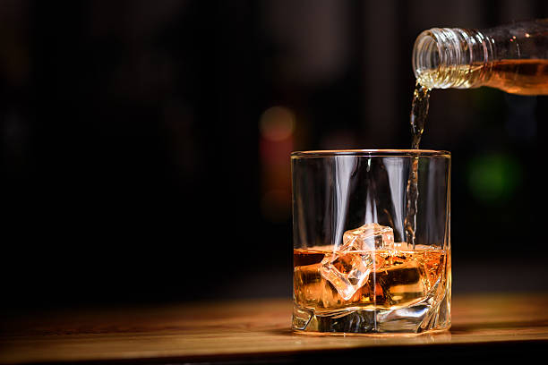 still life. pour or whiskey in to glass - alcohol drinks stockfoto's en -beelden