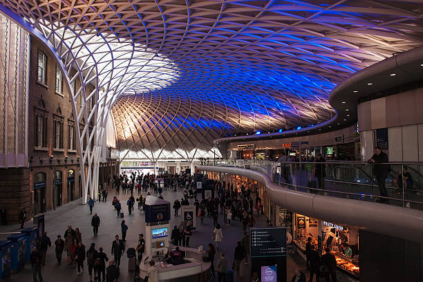 King's Cross Station in London London. UK - May 8, 2014: People in the departure concourse of King's Cross Station. The station serves as an important national railway terminus, and as part of the London Underground network. Eurostar stock pictures, royalty-free photos & images