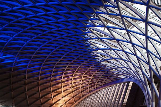 King's Cross Station in London London. UK - May 8, 2014: People in the departure concourse of King's Cross Station. The station serves as an important national railway terminus, and as part of the London Underground network. Eurostar stock pictures, royalty-free photos & images