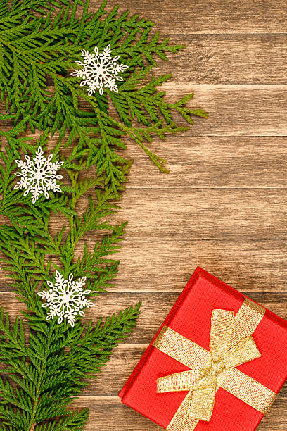 istock Christmas tree decoration on plank wood with gift 490361594