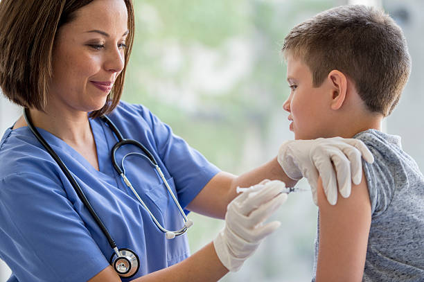 istock Giving a Vaccine to a Little Boy 490362470