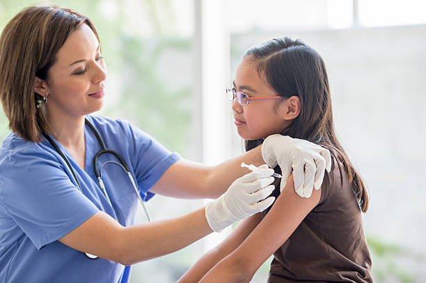 istock Vaccinating a Little Girl 490362576