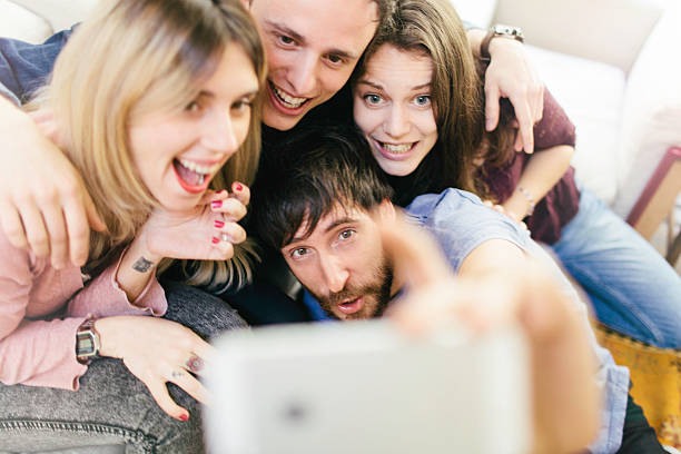 istock Friends making a selfie with a smartphone. 490362882