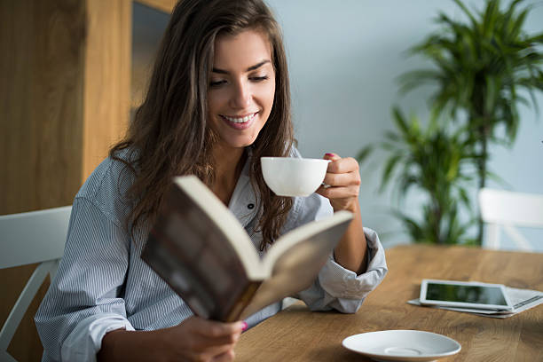 Good book and cup of coffee in the morning Good book and cup of coffee in the morning hair length stock pictures, royalty-free photos & images