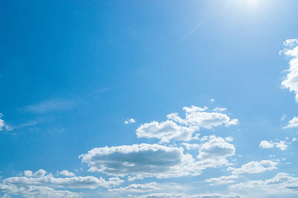 istock beautiful blue sky with clouds and sun 490367584