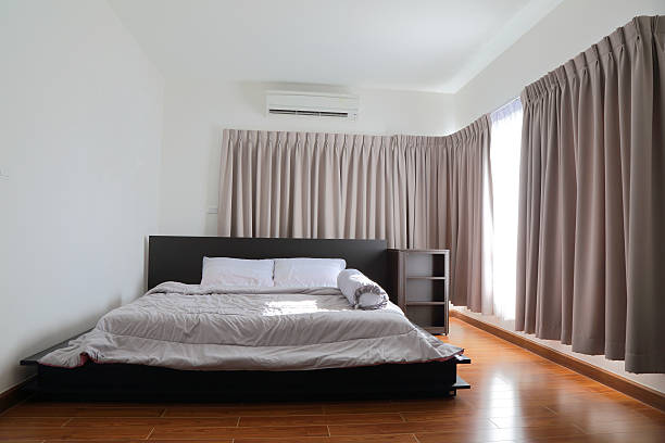 istock beautiful bedroom with light shining through the window 490368542