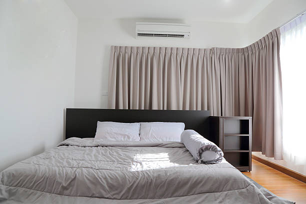 istock beautiful bedroom with light shining through the window 490368606