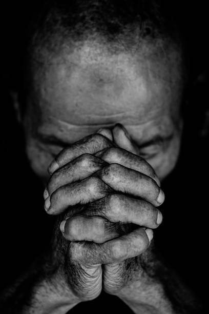 The clenched hands The clenched hands over head. prayer and hope concept church black and white people praying stock pictures, royalty-free photos & images